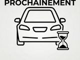 a black and white image of a car with an hourglass in front of it