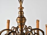 a chandelier that has a bunch of candles inside of it