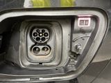 a close up of a car ' s interior with a car plugged in