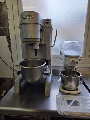 an image of a kitchen with a mixer and a bowl on the counter