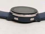 a close up of a smart watch on a white surface