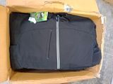 a black jacket in a cardboard box on the floor