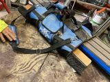 a person working on a piece of equipment in a workshop