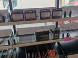 a lot of pens and pencils on display in a store