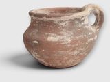 a clay pot with a handle on a white background