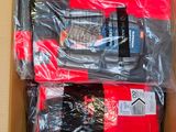 two pairs of men ' s red and black underwear in a cardboard box