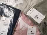 a lot of clothes that are sitting on a table