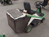 a lawn mower that is sitting in the garage