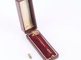 a small wooden box with a key inside of it