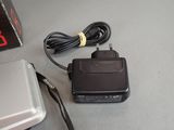 an image of a charger and a laptop on a table