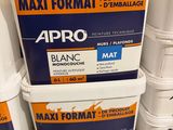 three buckets of paint are stacked on a pallet in a store