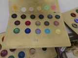 a lot of buttons in a box on a table