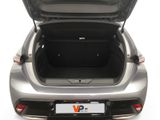 the back of a silver car with its trunk open on a white background
