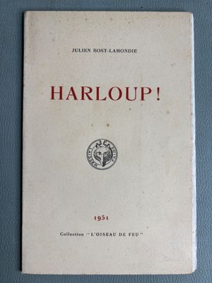 an old book on a blue surface with the title harloup
