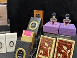 many different types of perfumes on display on a table