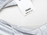 a close up of a white shirt with a label on it