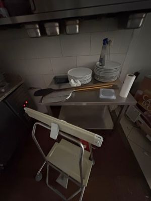 an image of a kitchen with a chair in it