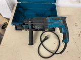 a blue tool box with a hammer and a cord