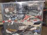 a large metal cage filled with assorted items
