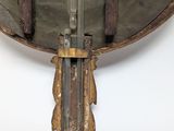a metal object that is hanging on the wall