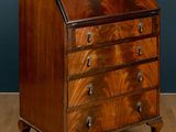 an antique walnut bureau on stand with drawers and drawers