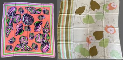 two different types of scarves are displayed on a table