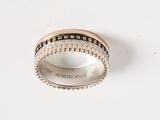an image of a wedding ring with black and white diamonds