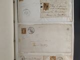 an open book with a bunch of old letters on it