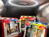 three nintendo wii games in the box on the couch