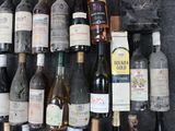 many bottles of wine that are on a rack