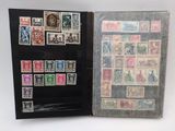 a book with a lot of stamps inside of it