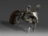 sculpture of a man on a horse with a gun in his hand