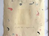 an image of a piece of paper with paint splatters on it