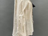 an image of a mannequin wearing a white shirt and black pants