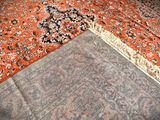 a carpet that is laying on the floor next to a rug