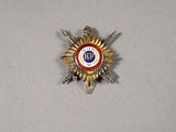 a badge with a star on it on a table