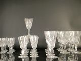 a lot of wine glasses that are sitting on a table