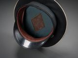 a black hat with a brown leather patch on it