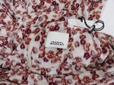 an image of a close up of a dress with a label on it