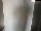 a metal cabinet in the middle of a room