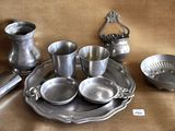a lot of silver items that are on a table