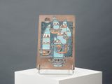 a picture of a blue and brown tile on a stand