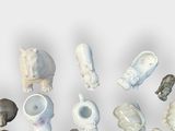 many different types of animal figurines on a white surface