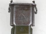 a metal object that is attached to a white wall