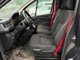 the interior of a car with the driver ' s seat folded down