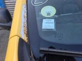 a sticker on the windshield of a car with a sticker on it