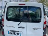 a white van that is parked in a parking lot