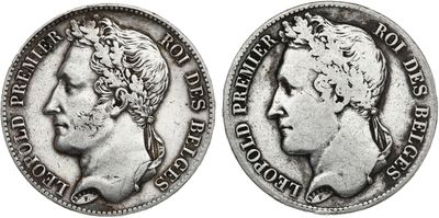 a silver coin with a man ' s head and a woman ' s face