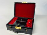 a black suitcase with red linings on it