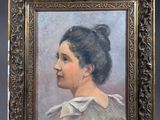 portrait of a woman in a brown dress in a gold frame